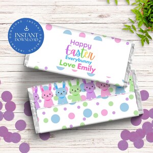 May include: White chocolate bar wrapper with a colorful polka dot pattern and a row of cartoon bunnies. The wrapper has the text "Happy Easter Everybunny Love Emily".