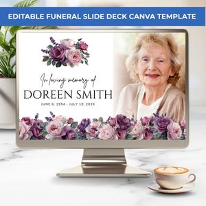 May include: An editable funeral slide deck Canva template displayed on a computer monitor. The screen shows a white background with purple and pink floral arrangements, the text In loving memory of DOREEN SMITH, and a placeholder photo of an elderly person.