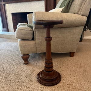 Drink table, Mahogany with dark Walnut stain. 21” tall. Cocktail table, martini table, tall end table, pedestal table, plant stand.