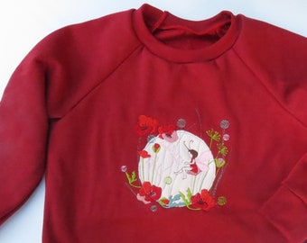 bestickter Sweater Kinderpullover GOTS Biobaumwolle Mohnblume Elfe Fee Blumenwiese Käfer Schmetterling