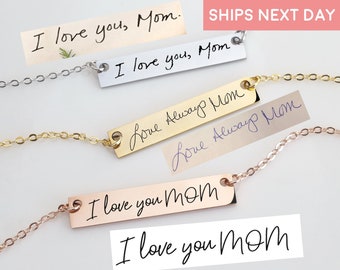 May include: Four necklaces with different chain styles and bar pendants. The pendants are engraved with the text "I love you, Mom" in various handwriting styles. The text "SHIPS NEXT DAY" is visible in the top right corner of the image.