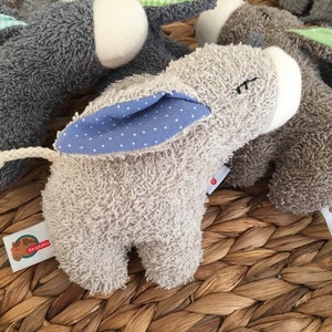 Mini donkey with desired ears as a cuddly toy or rattle helltaupe