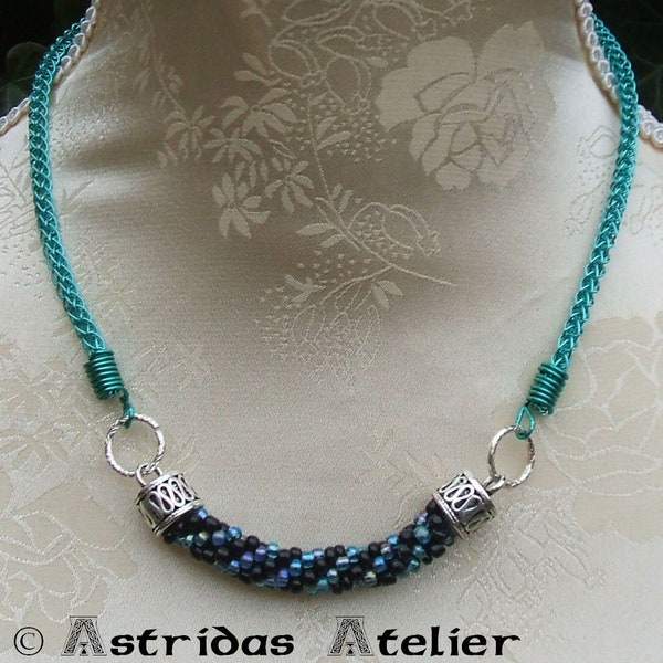 Necklace knitted in turquoise from wire and with crocheted insert made of glass beads