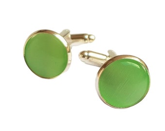 2 cufflinks with green Cateye Cabochons