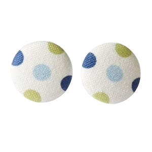 May include: A pair of white fabric button earrings with blue, green, and light blue polka dots.