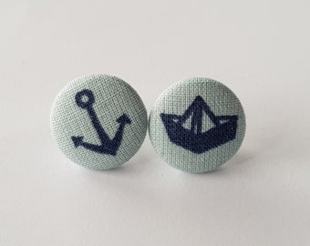 Studs with anchor and paper boat