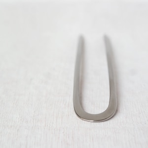 Hair fork made of titanium, forged