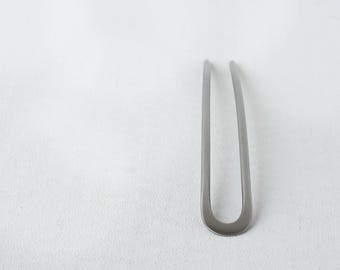 Horquilla para el cabello hecha de titanio, forjada