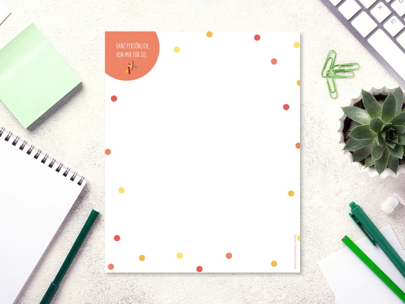 May include: A white sheet of paper with a red circle at the top. The circle has the text "Ganz pers&ouml;nlich, von mir f&uuml;r Sie." in black text. The paper is decorated with small red and yellow dots.
