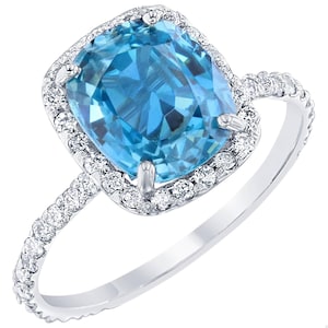 Anillo de compromiso de oro blanco de 18 quilates con diamantes y circonita azul de 4,27 quilates