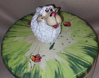 round ceramic bread pot with sheep as a knob