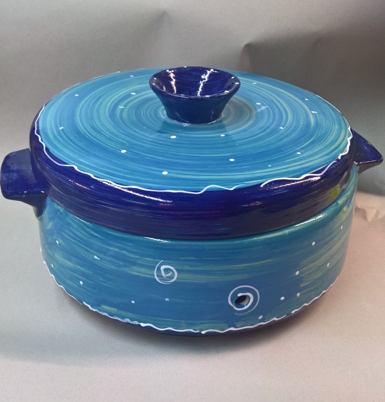 large ceramic bread crock in various blue patterns puncto