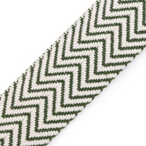 May include: Green and white chevron patterned fabric trim. The trim is woven with a zig-zag pattern.