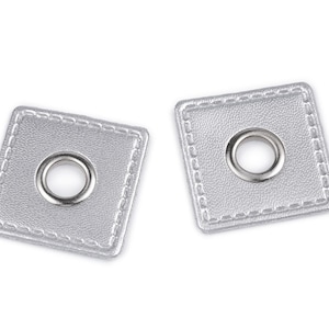 May include: Two silver square magnetic snaps with a stitched border and a metal eyelet in the centre. These snaps are used for closures on bags, wallets, and other craft projects.