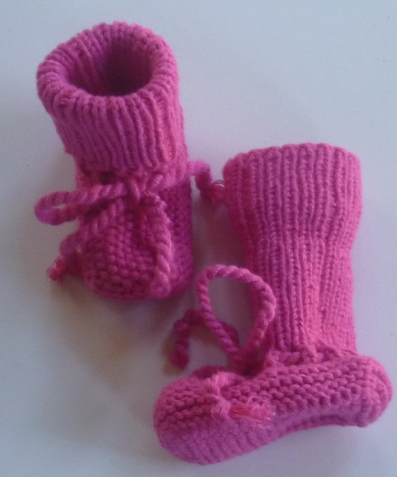 With lovely hand-knitted baby knitting shoes