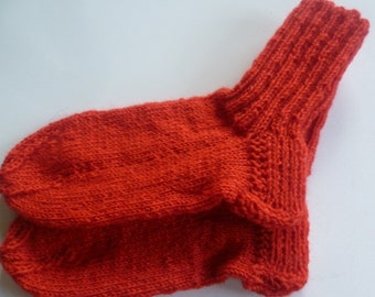 Hand-knitted baby socks with love