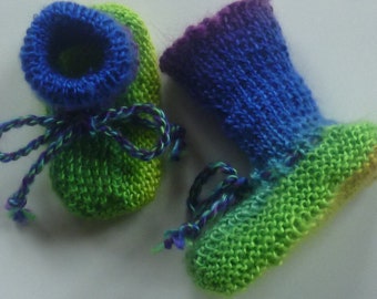 With lovely hand-knitted baby knitted shoes sole length about 9.5 cm