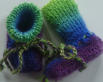 With lovely hand-knitted baby knitted shoes sole length about 9.5 cm