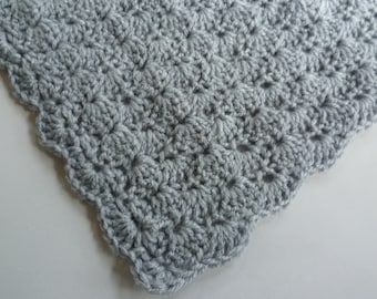 1 crocheted baby blanket in shell pattern