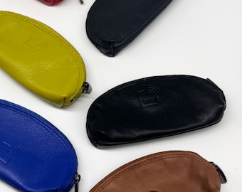 May include: Assortment of six leather card holders in various colors, including red, yellow, blue, brown, and black. Each holder features a small RFID logo.
