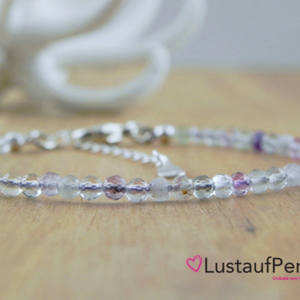 Fluorite gemstone bracelet made of 3 mm faceted beads with extension chain.