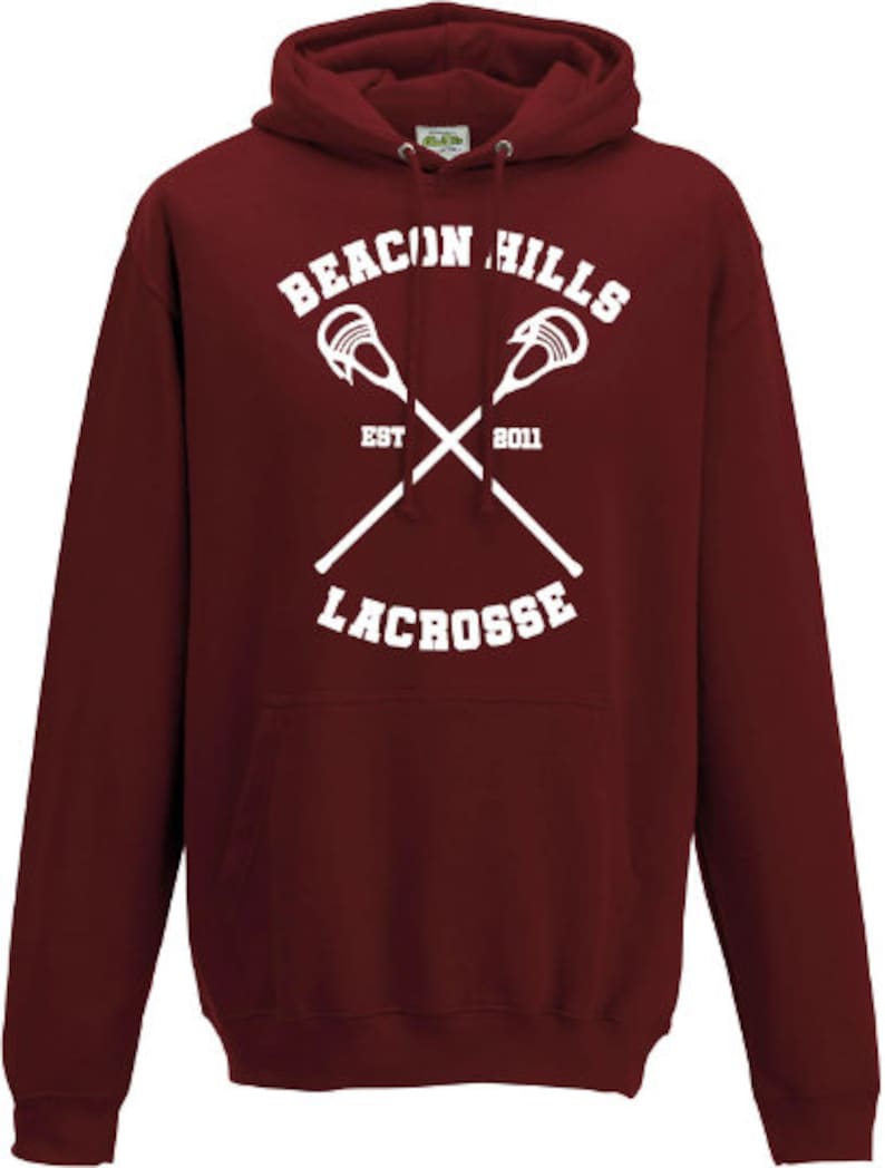 May include: Burgundy hooded sweatshirt with a white graphic of crossed lacrosse sticks and the text "Beacon Hills Lacrosse Est 2011".