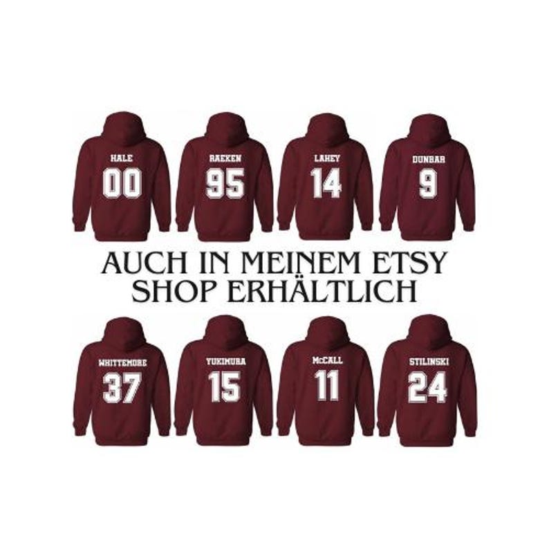 May include: Burgundy hooded sweatshirts with white numbers and names printed on the back. The names include Hale, Raeken, Lahey, Dunbar, Whittemore, Yukimura, McCall, and Stilinski. The numbers include 00, 95, 14, 9, 37, 15, 11, and 24.