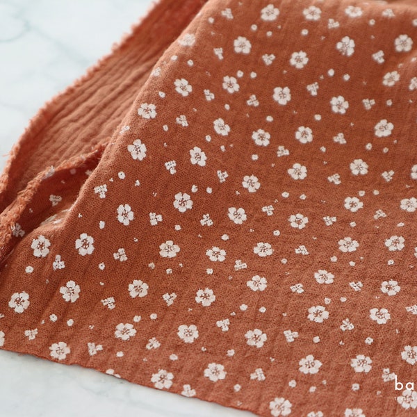 Muslin fabric with small flowers terracotta | Double Gauze sold by the meter from 0.5 m (11.90 EUR/meter)
