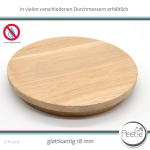 Könnte beinhalten: Ein runder, hölzerner, hellbrauner Untersetzer mit glatten Kanten und einer Dicke von 18 mm. Der Untersetzer ist nicht wasserfest. Der Text "glattkantg 18 mm" ist unter dem Untersetzer gedruckt.
