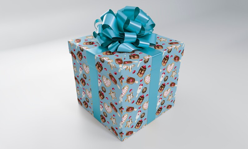 May include: A square gift box wrapped in light blue paper with a pattern of various desserts. The box is adorned with a matching light blue ribbon and a large bow on top. The overall theme is a celebration or special occasion.