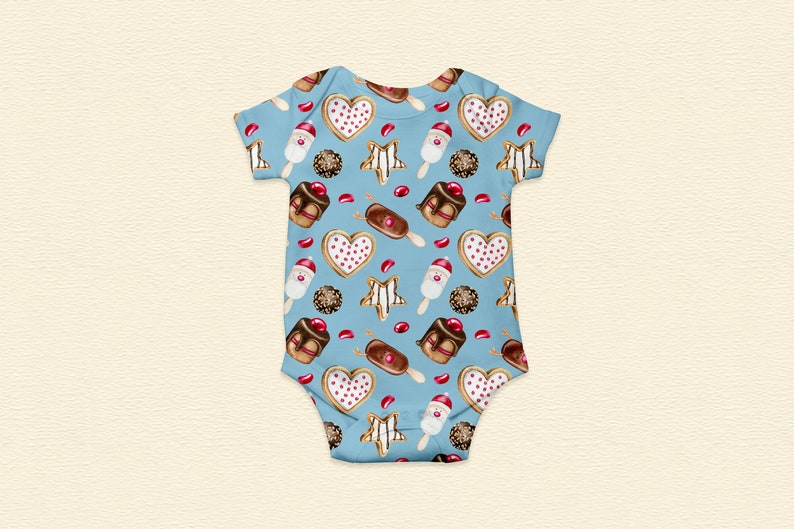 May include: A light blue baby onesie with a repeating pattern of illustrated sweets. The pattern includes heart-shaped cookies, star-shaped cookies, chocolate-covered ice cream bars, and chocolate candies. The onesie is made of soft fabric.