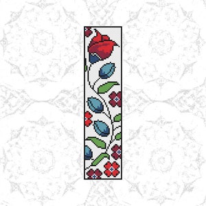 May include: A vertical floral design with red, blue, and green flowers on a white background. The design is reminiscent of a cross-stitch pattern.