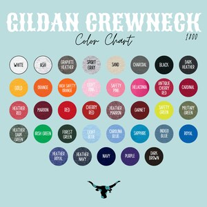 May include: Color chart for Gildan Crewneck 1800 t-shirts. The chart shows a variety of colors, including white, ash, graphite heather, sport gray, sand, charcoal, black, dark heather, gold, orange, high safety orange, light pink, safety pink, helac&ocirc;nia, antique cherry red, cardinal, heather red, maroon, red, cherry red, heather maroon, garnet, safety green, military green, heather dark green, Irish green, forest green, light blue, Carolina blue, sapphire, indigo blue, royal, heather royal, heather navy, navy, purple, and dark brown.