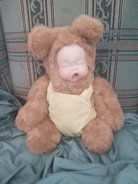 teddy bear with doll face