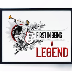 May include: Framed art print with a black border. The print features a classical illustration of a figure blowing a trumpet, with text that reads "FIRST IN BEING A LEGEND" and "LAST IN P.E."
