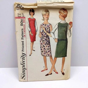 May include: Simplicity Printed Pattern 50c in Canada 60c. Vintage sewing pattern for a sub-teen dress. The pattern shows three models wearing different versions of the dress: one in red, one in a paisley print, and one in green.