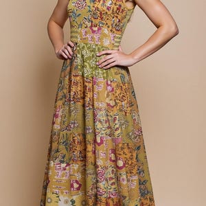 May include: A sleeveless, floor-length dress with a patchwork design. The dress features a mix of floral and geometric patterns in shades of yellow, green, and pink. The dress has a fitted bodice and a flowing skirt, suitable for a summer occasion.