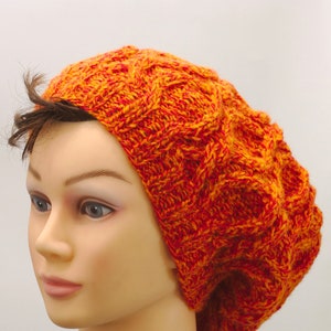 Slouchy orange cable hat, winter hand knitted head warmer image 1