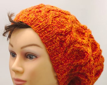 Slouchy orange cable hat, winter hand knitted head warmer