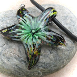green-colored glass pendant starfish