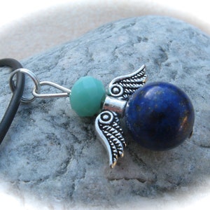 turquoise-blue guardian angel pendant made of glass and lapis lazuli