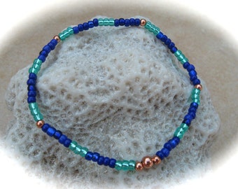 roségoud-turquoise-blauwe glazen kralenarmband, elastische armband, boho armband, vriendschapsarmband, kralenarmband
