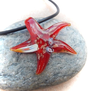red-colored glass pendant starfish