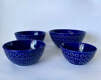 old set of dark blue bowls with the same circle motif