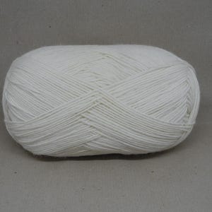 May include: A ball of white yarn, ready for knitting or crocheting.