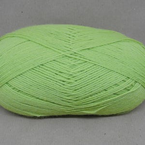 May include: A ball of light green yarn.