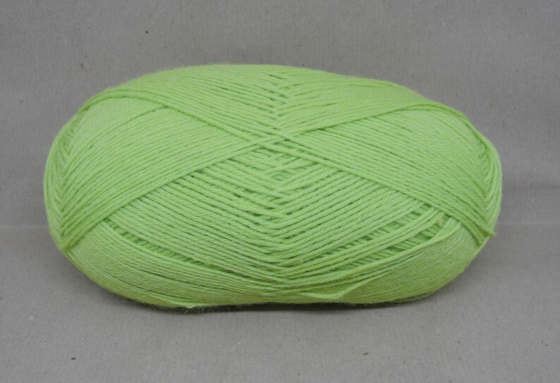 May include: A ball of light green yarn.