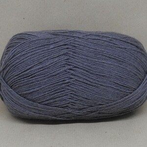 May include: A ball of dark grey yarn.
