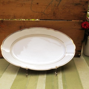 White oval serving platter with gold rim and wavy edge Schumann Arzberg #1511993779