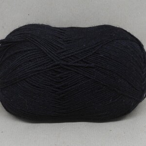 May include: A ball of black yarn.